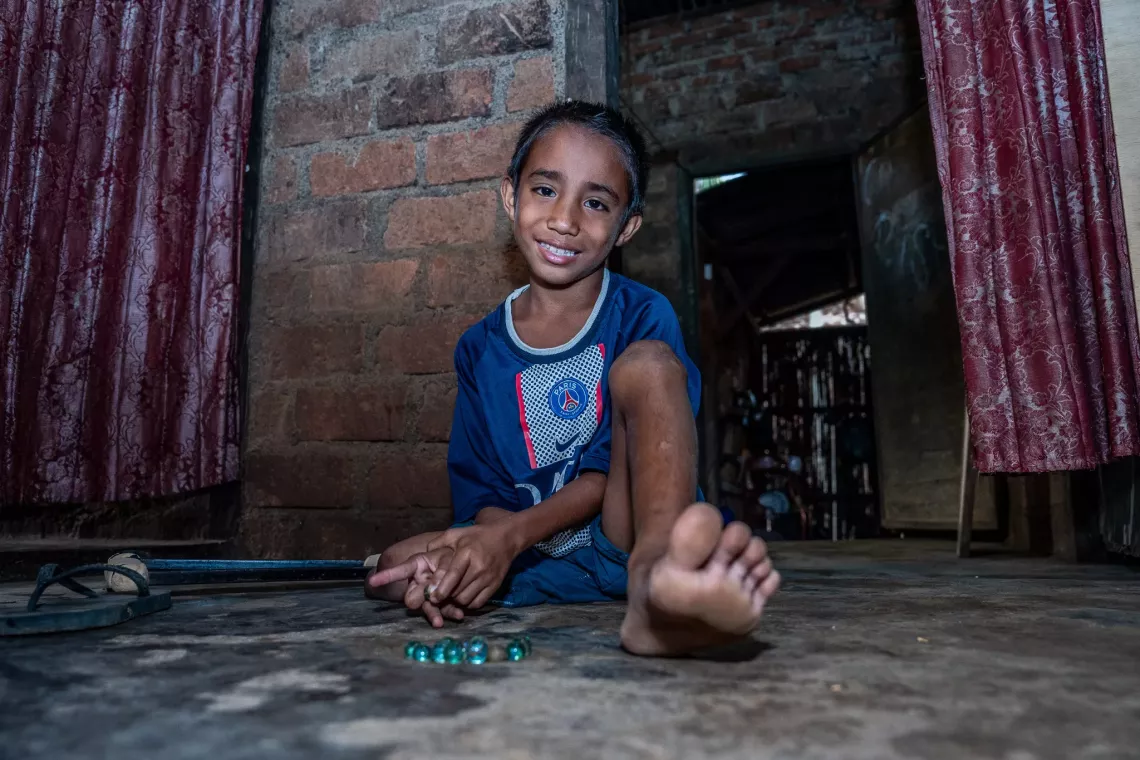 Chafanno Tupehoda, 8, plays marbles in his house in Lewopulo Village in Larantuka Island, East Nusa Tenggara. 