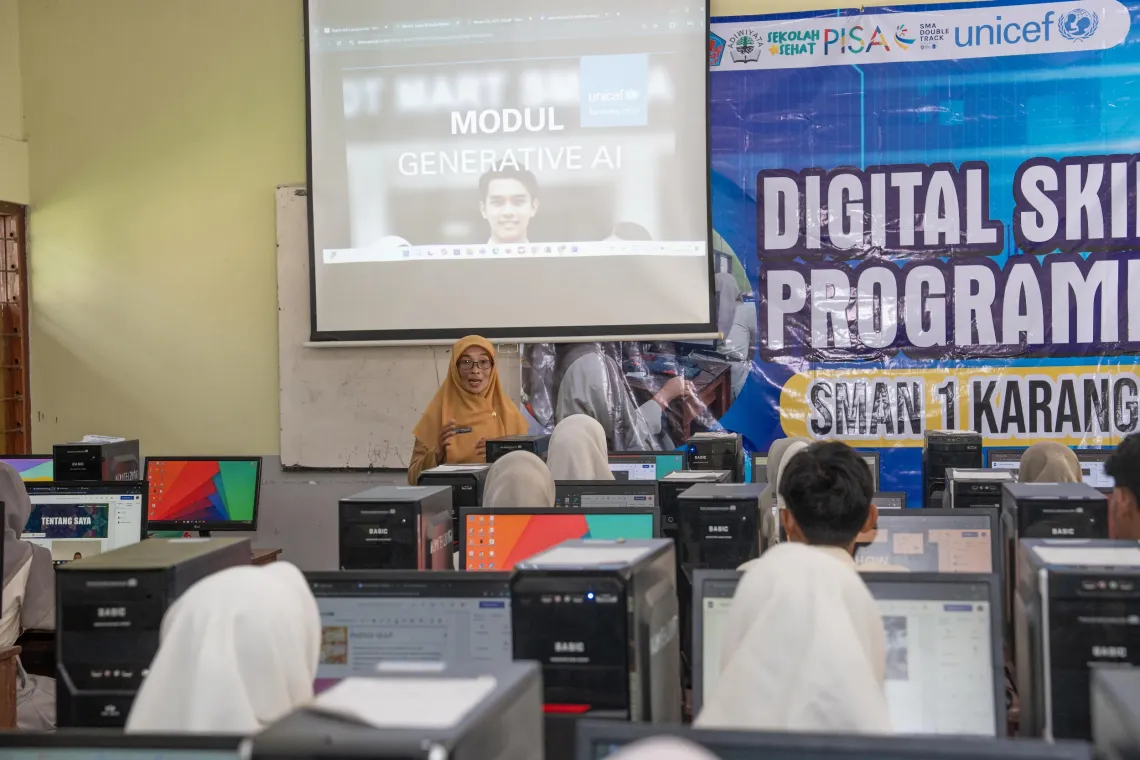  Skills4Girls programme participants present their projects to Dyah in the computer lab of SMAN 1 Karangan, Trenggalek, East Java, on 23 September 2025.