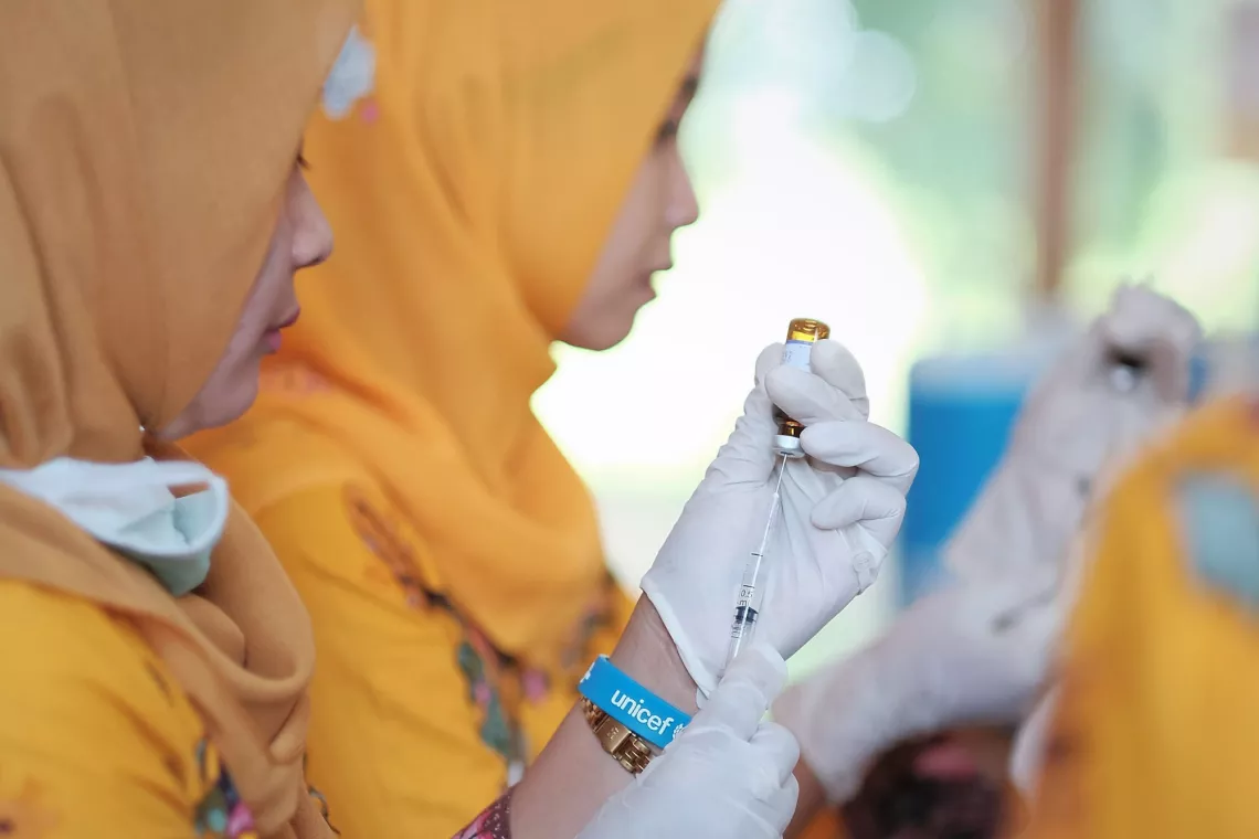 A nurse preparing to administer an injection.