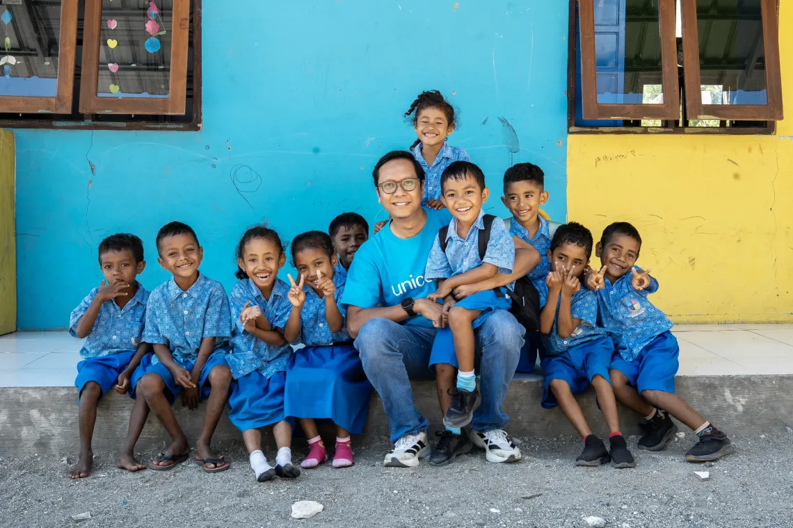 Nugroho Warman, Education Specialist, with students of Harapan Bangsa Early Childhood Development (ECD) Centre. Kupang District, East Nusa Tenggara Province, Indonesia.