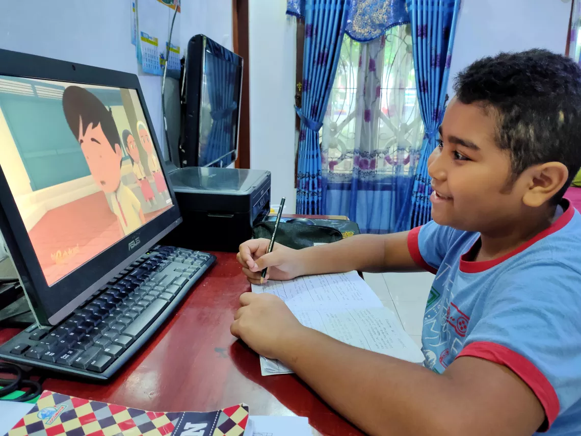  Joaquin participates in an online learning activity at home.