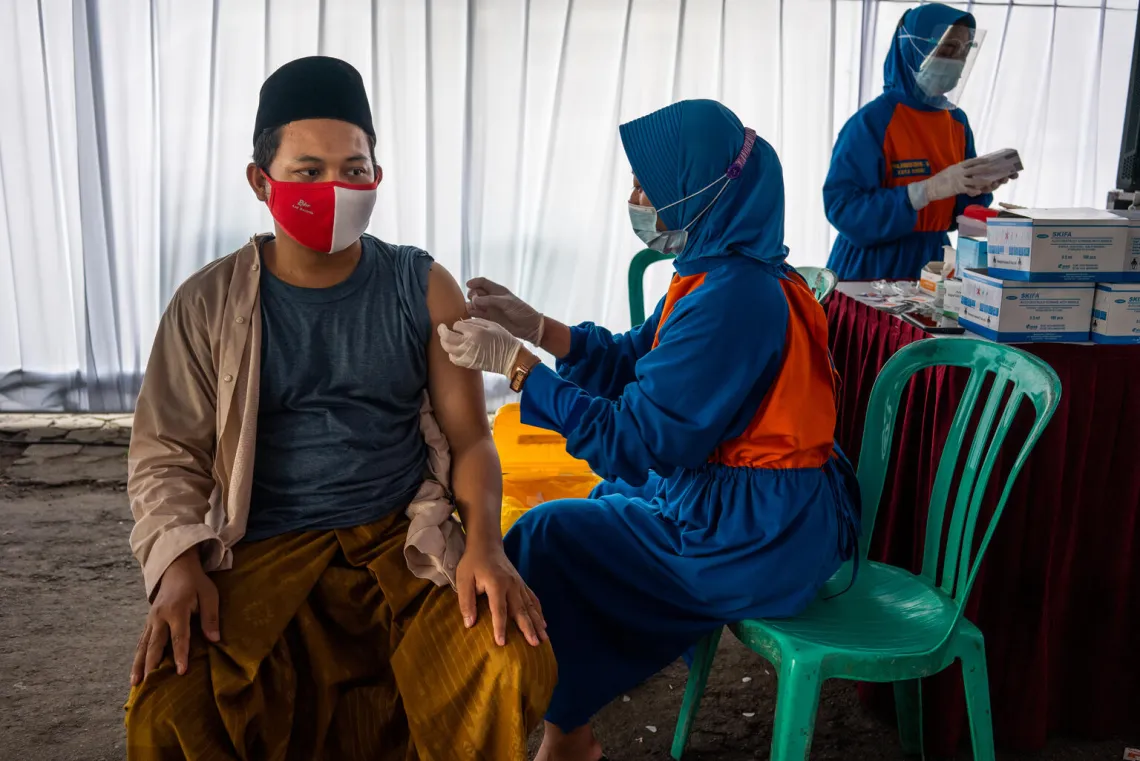 Religious leaders, teachers and students receive the COVAX COVID-19 vaccine