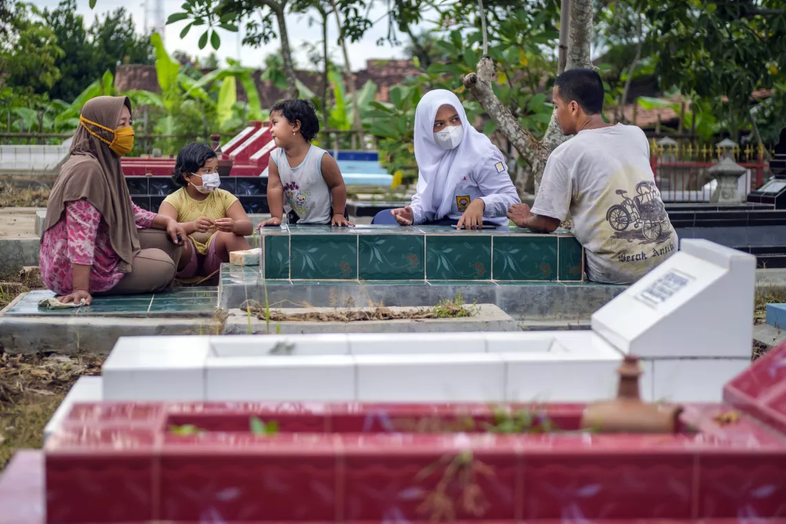 Afiqa and her family visit her late mother&rsquo;s grave, which they do almost every day.
