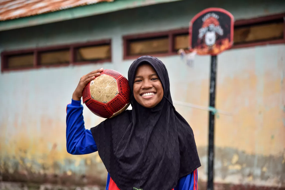 Tia plays futsal at her school yard of Kampung Baru Primary School, Larantuka, Flores Timur District, East Nusa Tenggara 