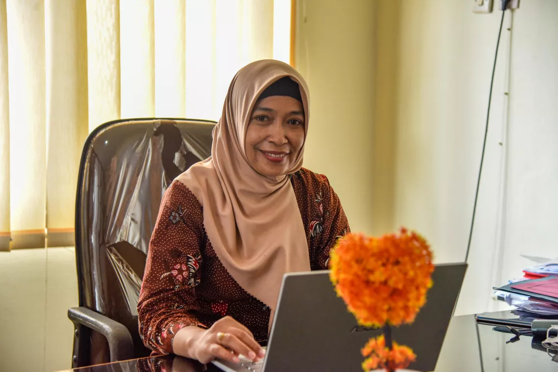 Rida Kusumawati, the Head of Government and People&rsquo;s Walfare poses in her office of BAPPEDDALITBANG in Purbalingga.  