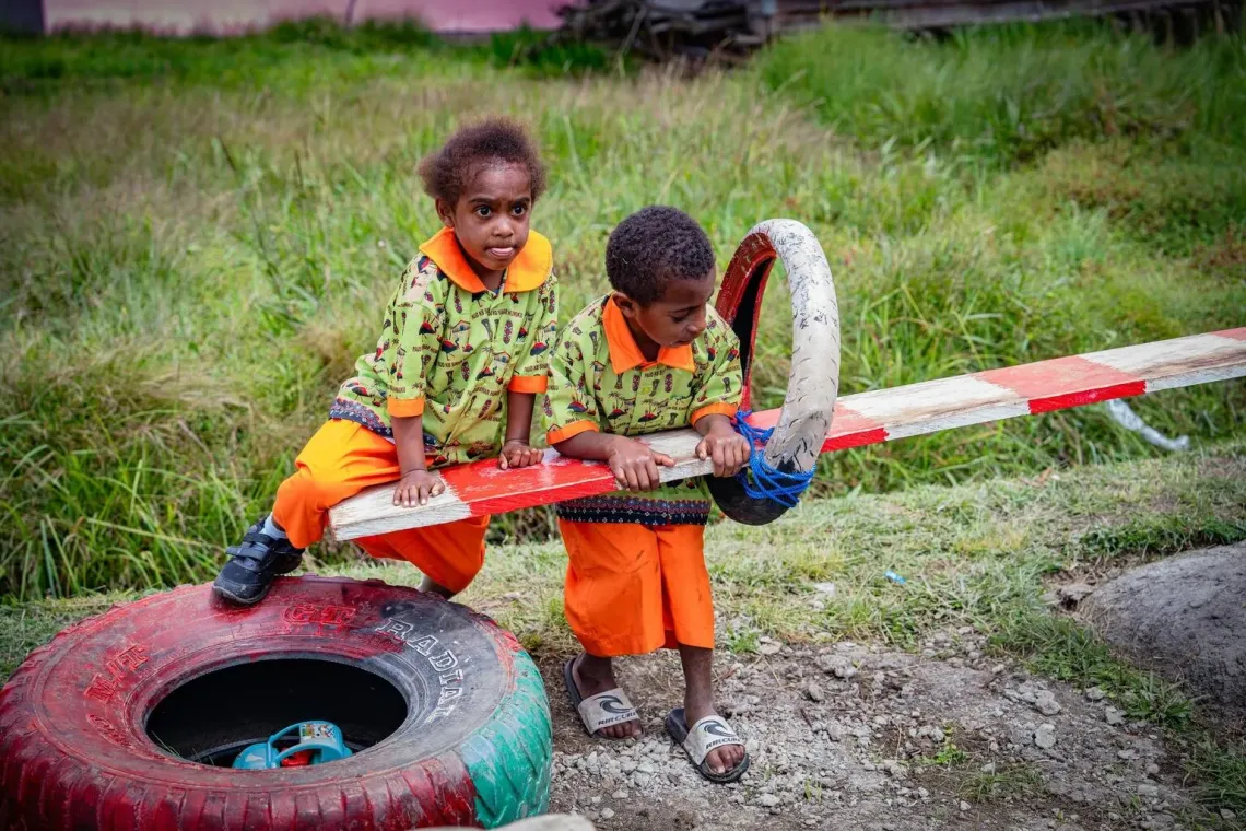 Kerenzia, 3, and her friends play in the school&rsquo;s front yard, at the Sinar Hungku Early Child Education Centre, Arfak Mountains, Papua, on 13 August 2025.