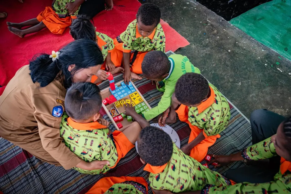 Students learn about literacy at the Sinar Hungku Early Child Education Centre, Arfak Mountains, Papua, on 13 August 2025.