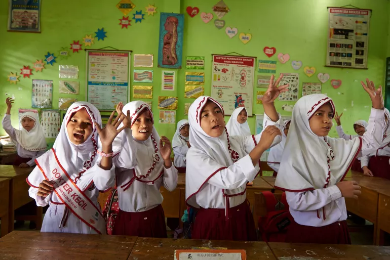 A group of children sing a song about hand washing and cleanliness in grade 6 at Pangembang Public School (SDN 42) in Takalar District in South Sulawesi Province. Indonesia.