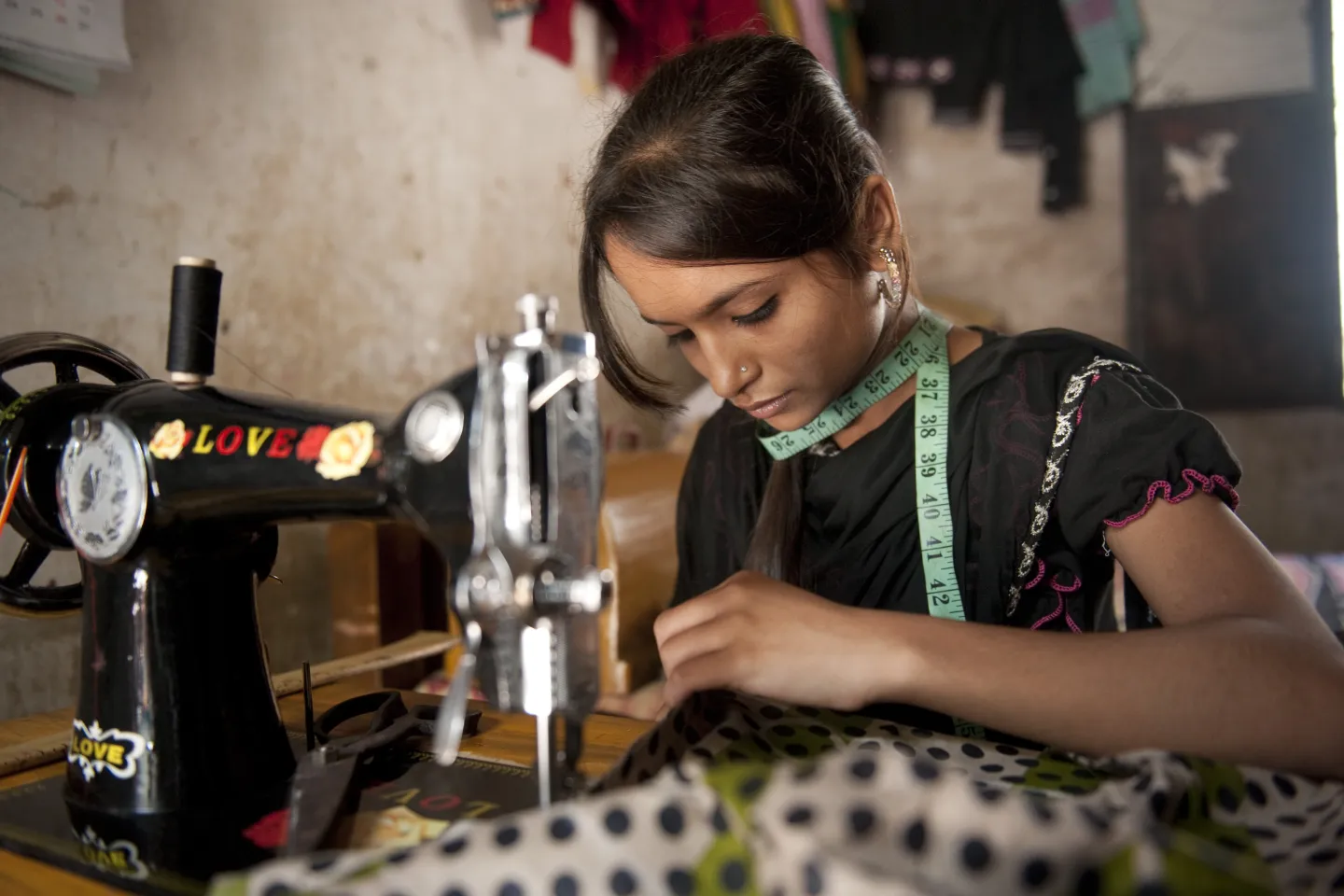 Teen using a sewing machine