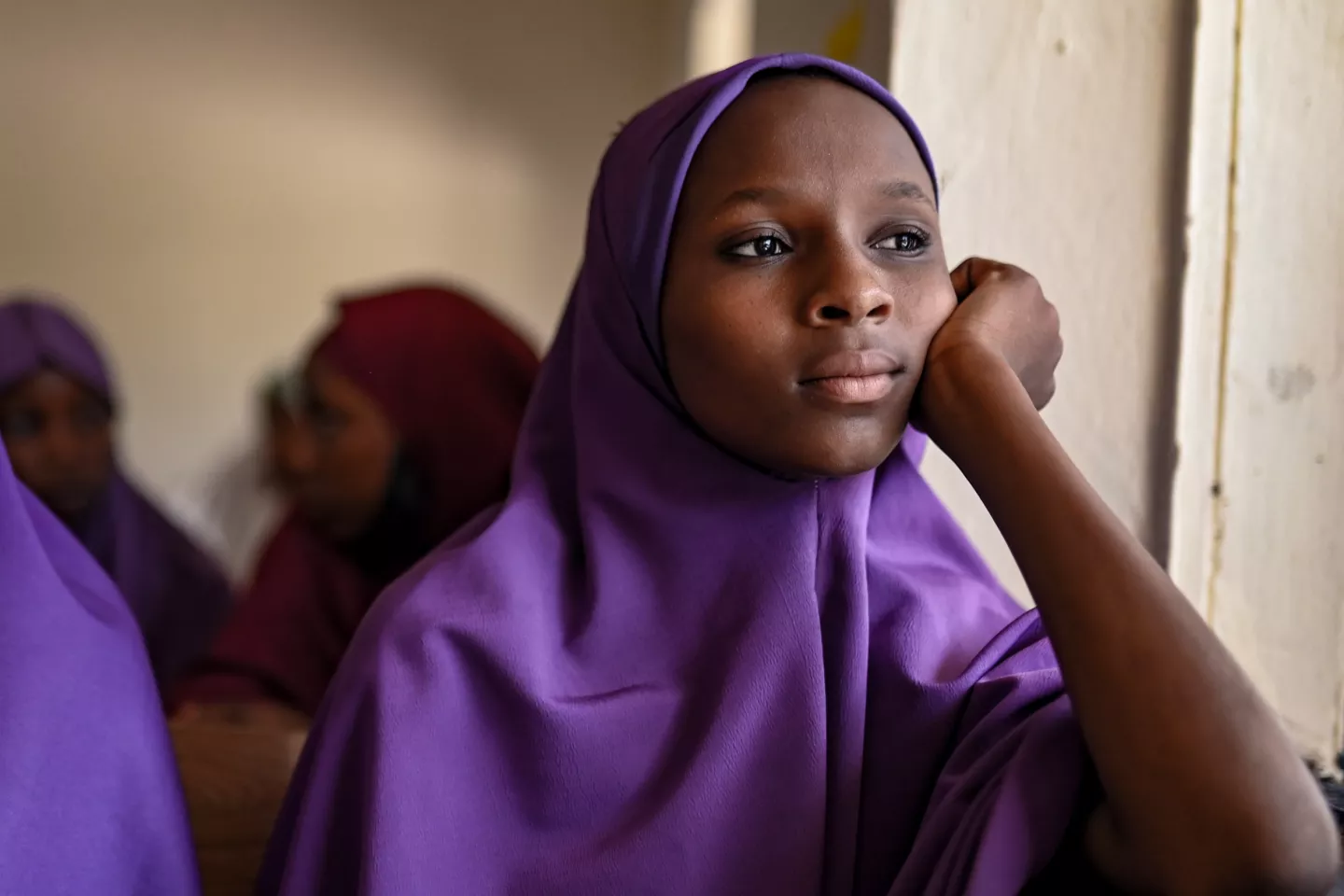 Portrait of an adolescent girl in a classroom