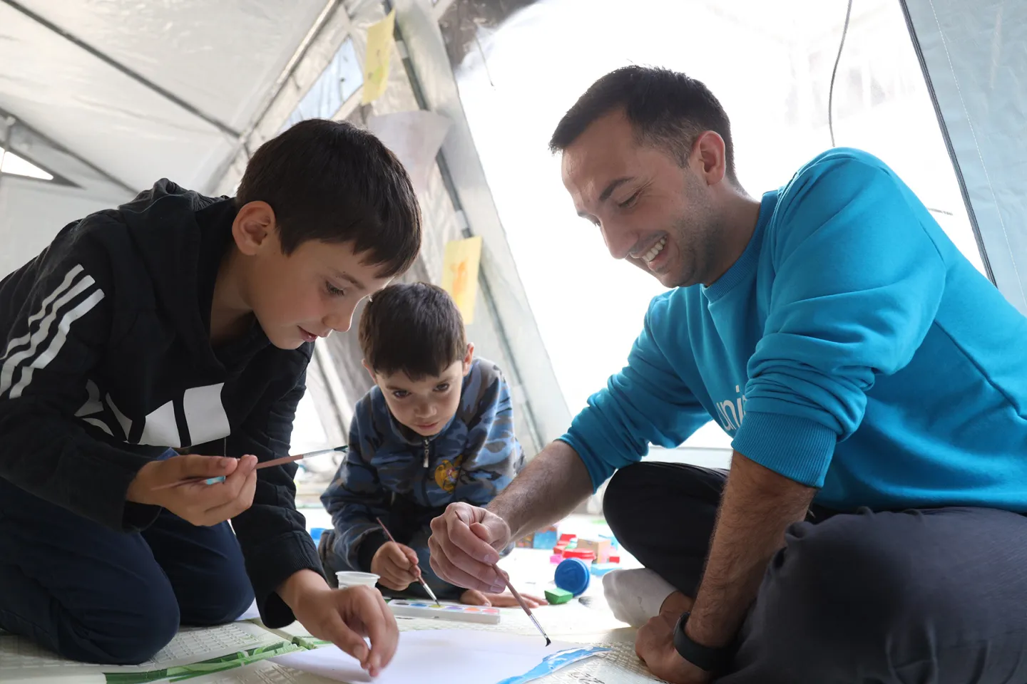UNICEF&rsquo;s Social Protection Officer playing with children who have fled to Armenia due to the escalation of conflict in the region