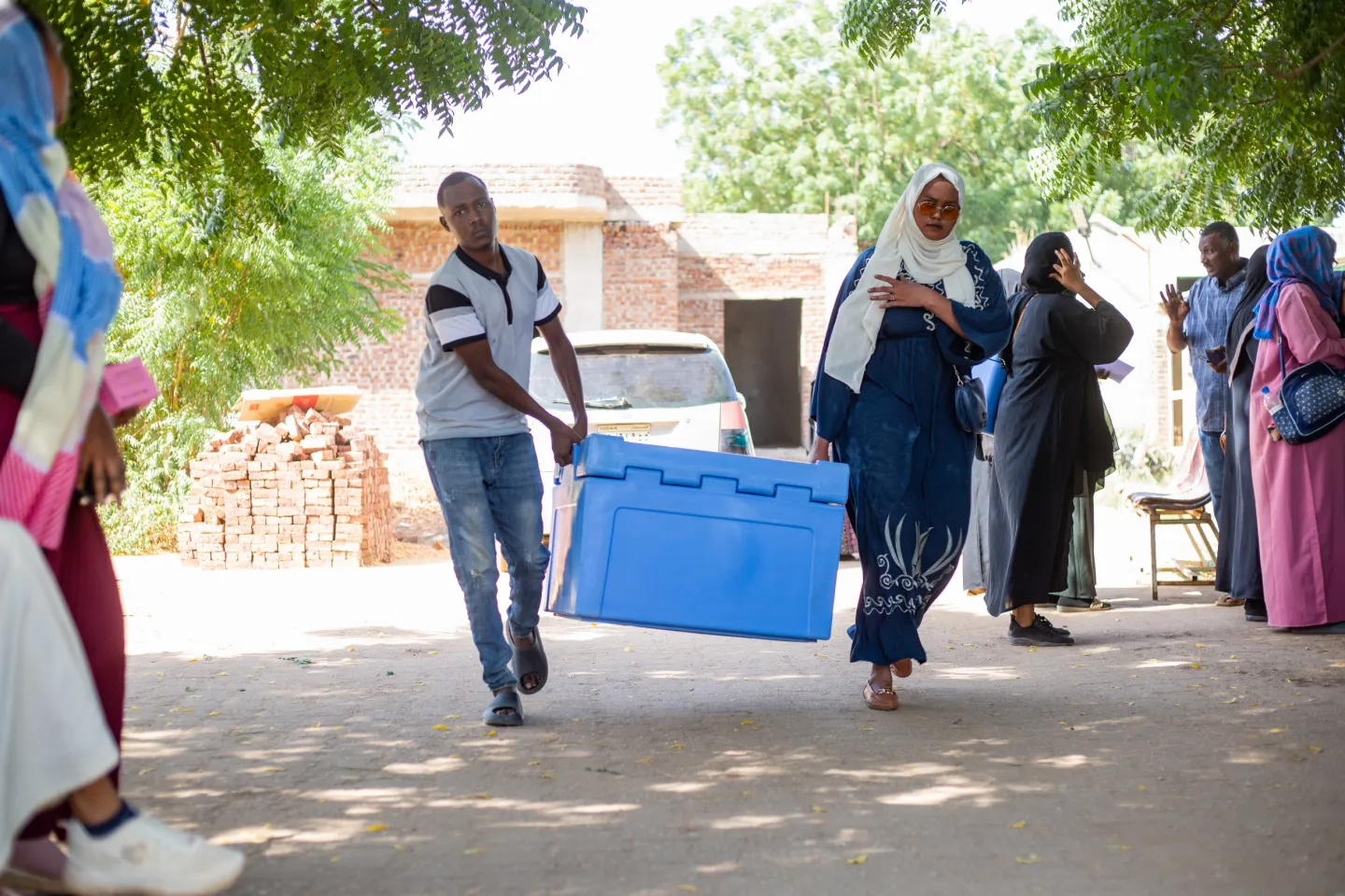 Health workers deliver doses of the cholera vaccine