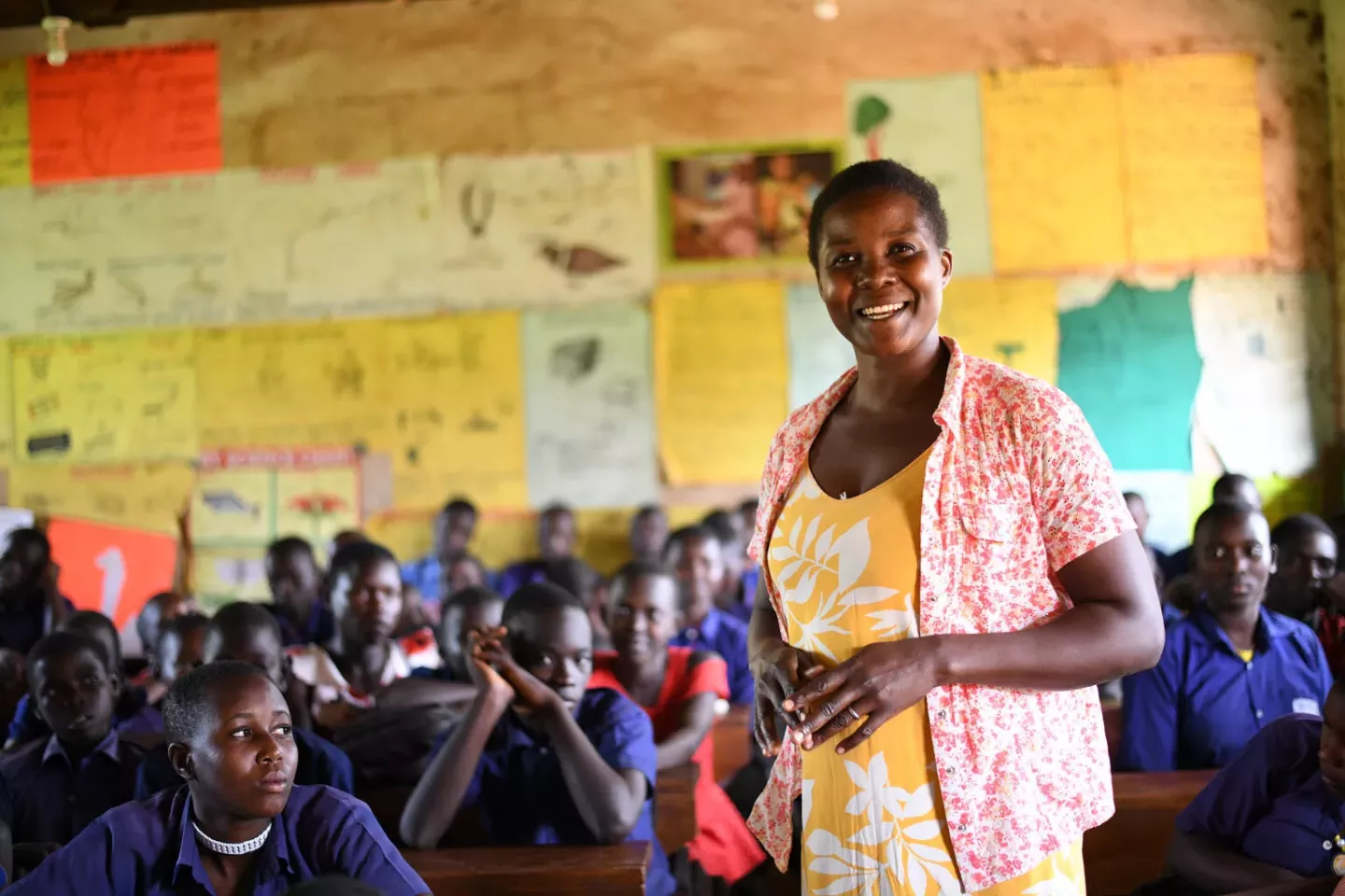A teacher with her class in Uganda