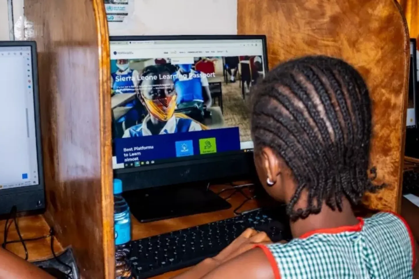 A student looking at a monitor