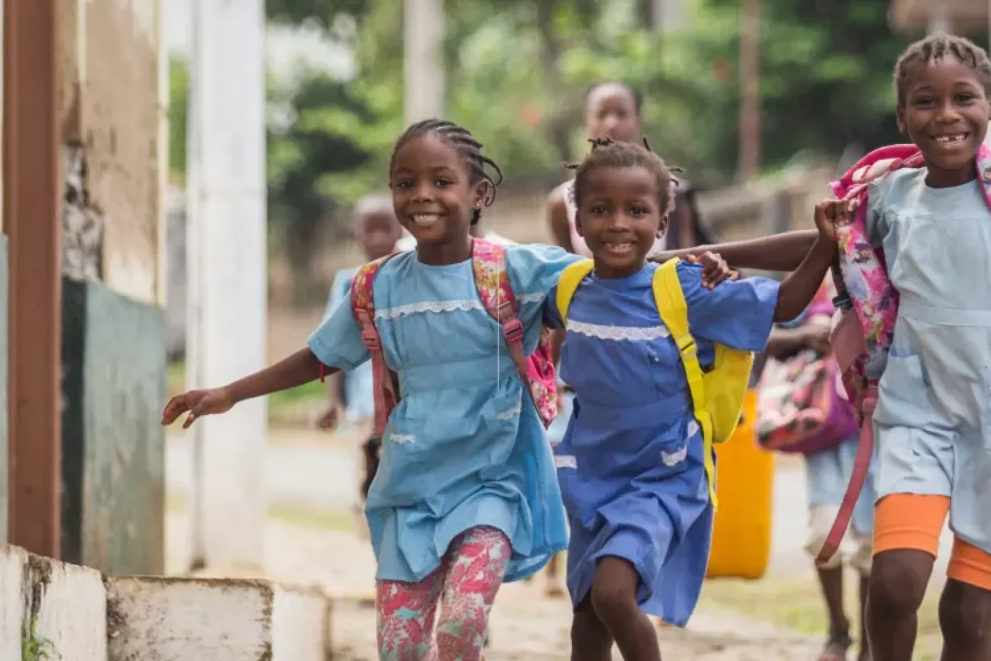 School children running and smiling