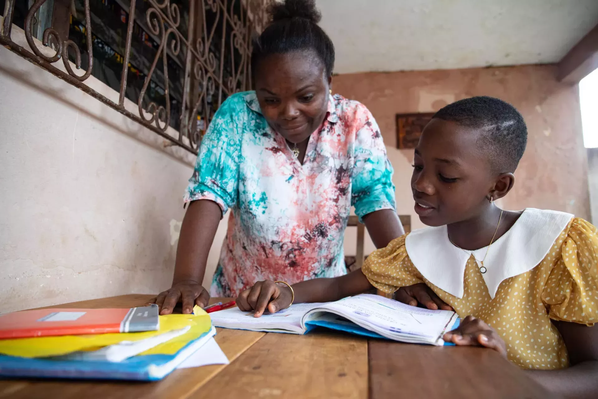 A woman teaching a student in Cote d'Ivoire