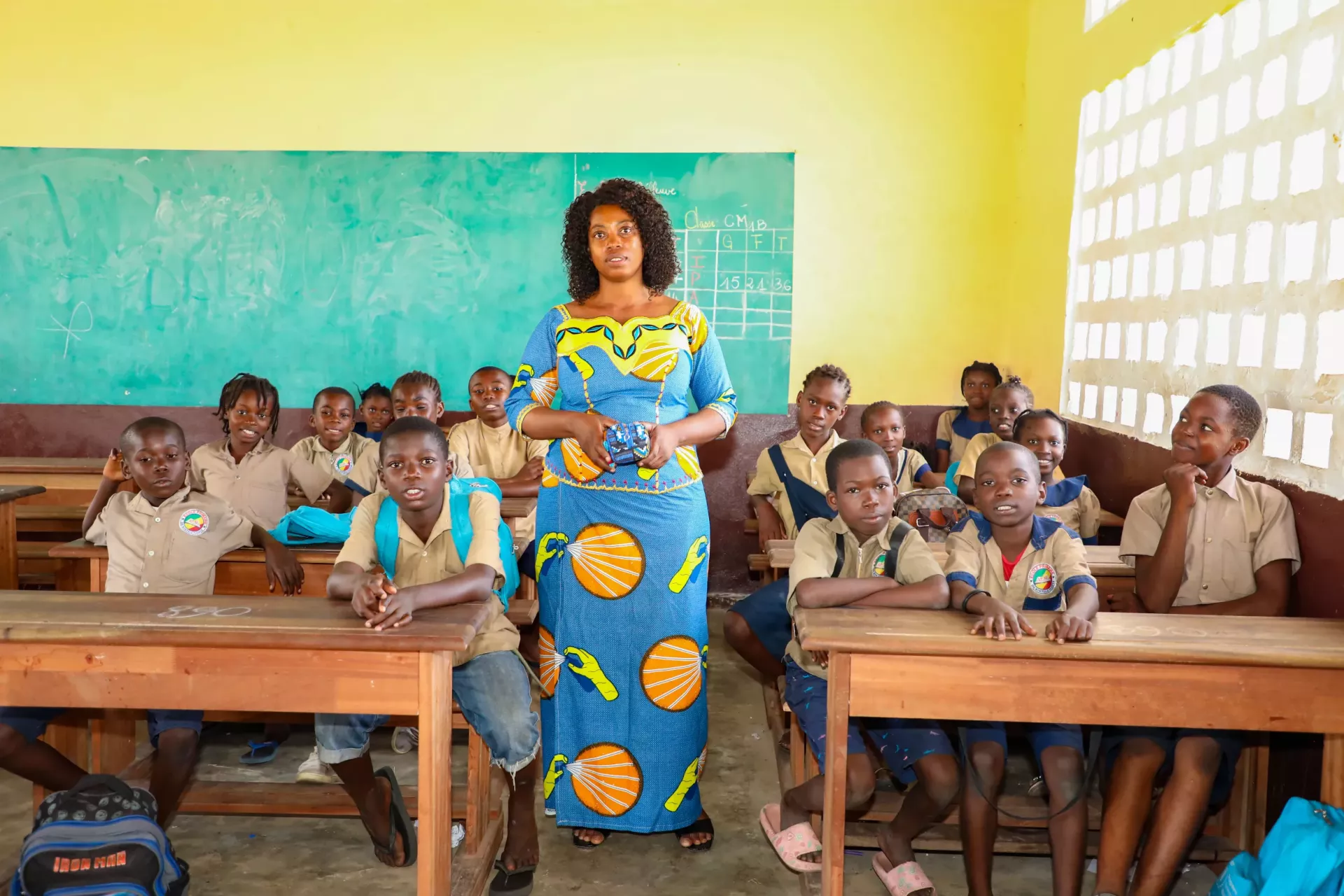 Teacher and her class in Congo