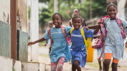School children running and smiling
