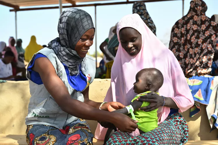 Two women and  baby in Africa