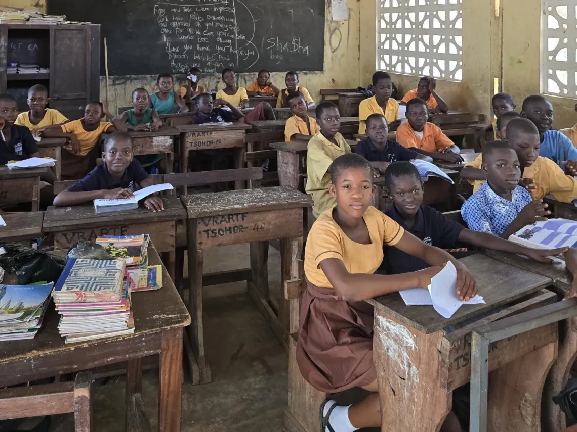 Students are seated in a classroom in rural Ghana