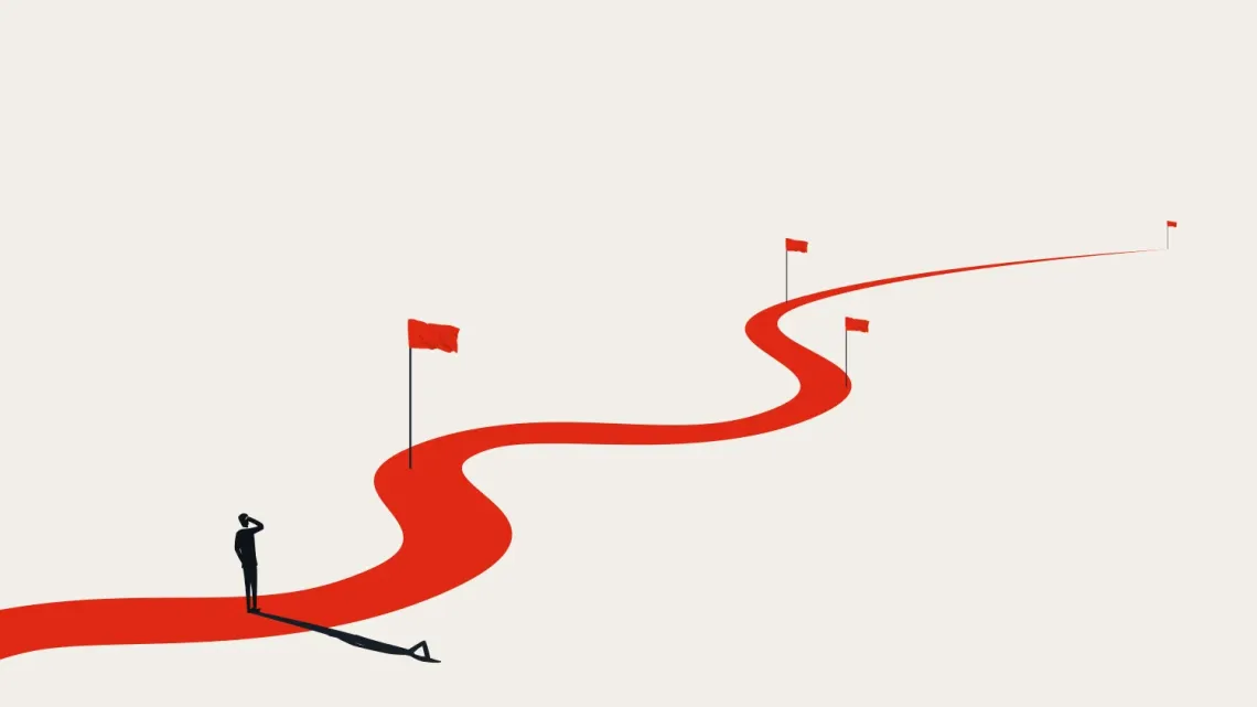 minimalist illustration of a person standing on a curvy red pathway with three red flags, against white background