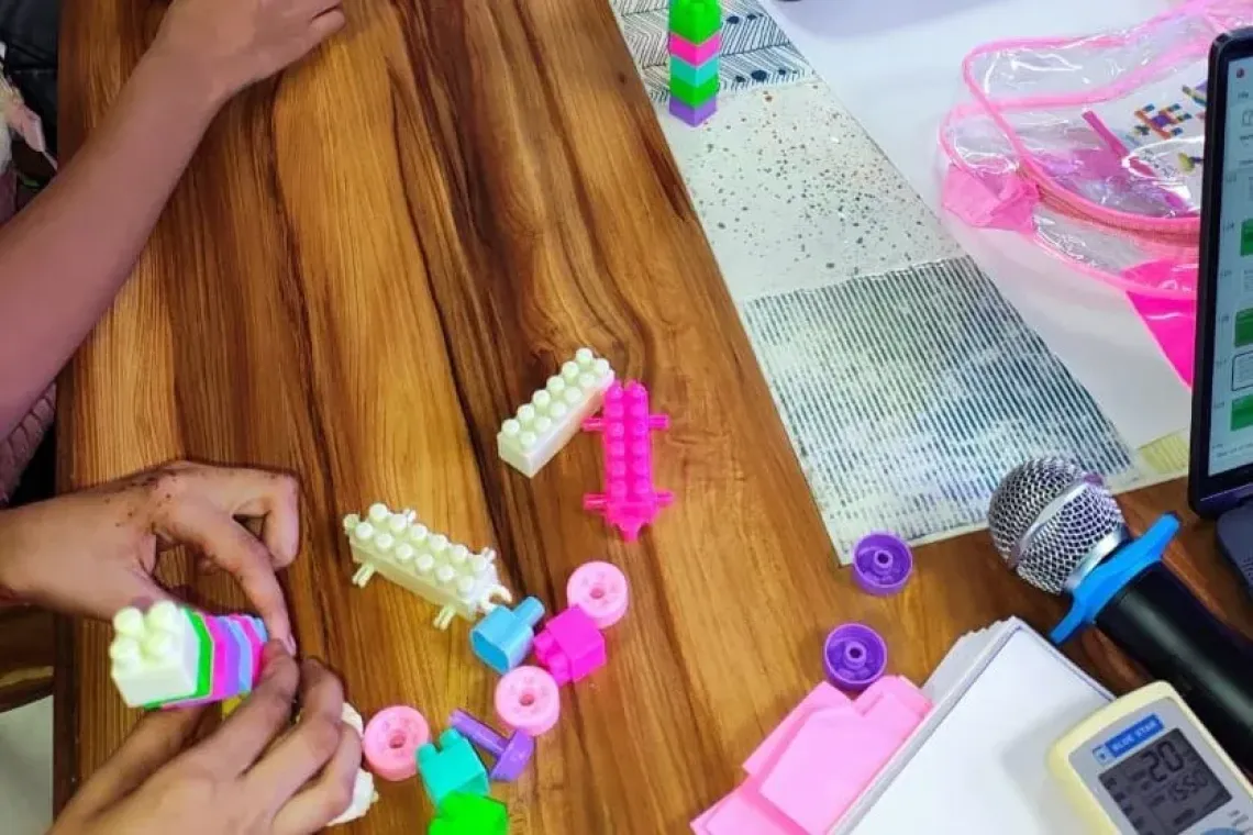 Children in India build models of future technology using Lego blocks