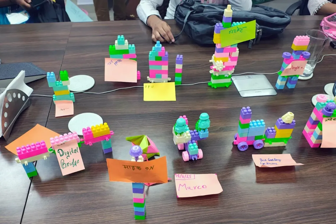A display of Lego models created by children showcasing future digital technology.