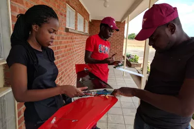 Students from Malawi University of Science and Technology building a drone at Kasungu Drone Corridor. 