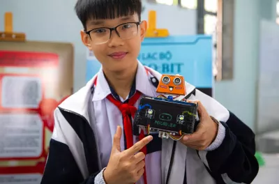 Boy holding AI powered device