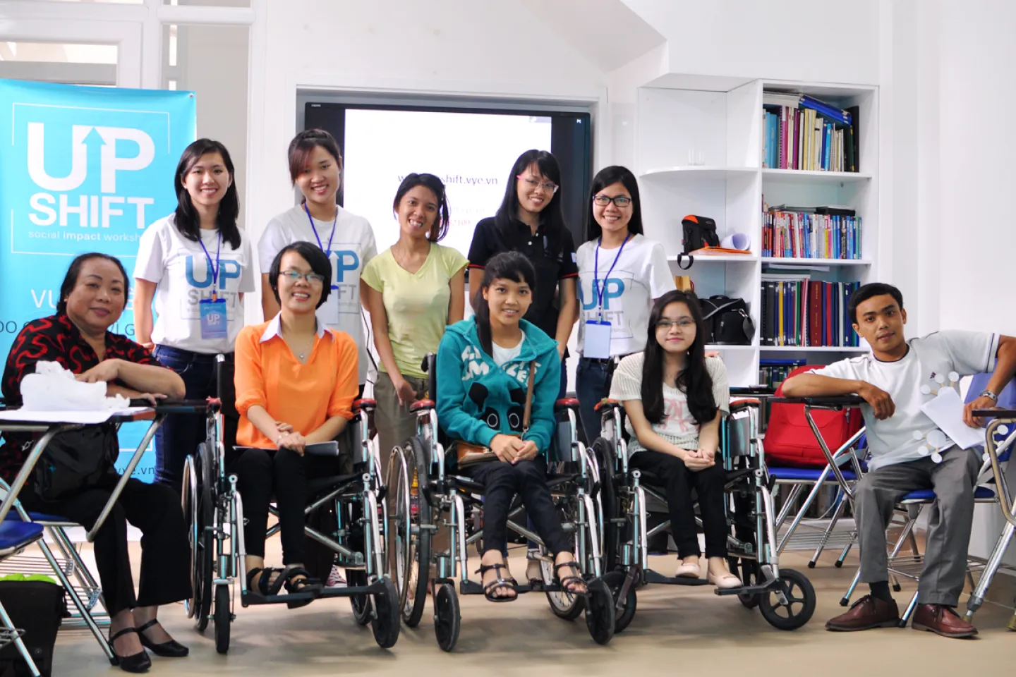Kim Van in blue T-shirt in the middle at Outreach event for disabilities at The Disability Research & Capacity Development Center (DRD), District 9, HCMC UPSHIFT Outreach.