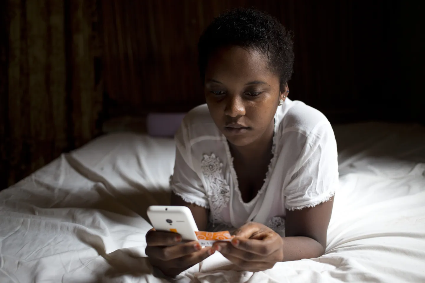A girls checks her smartphone.