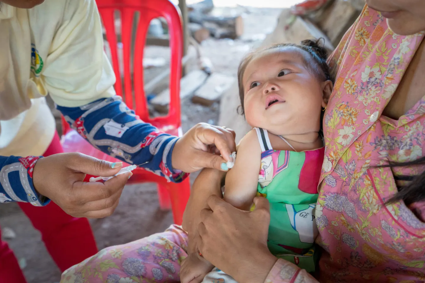 Thea Sreyvi receiving vaccines from Sambo health Centre&rsquo;s staff.