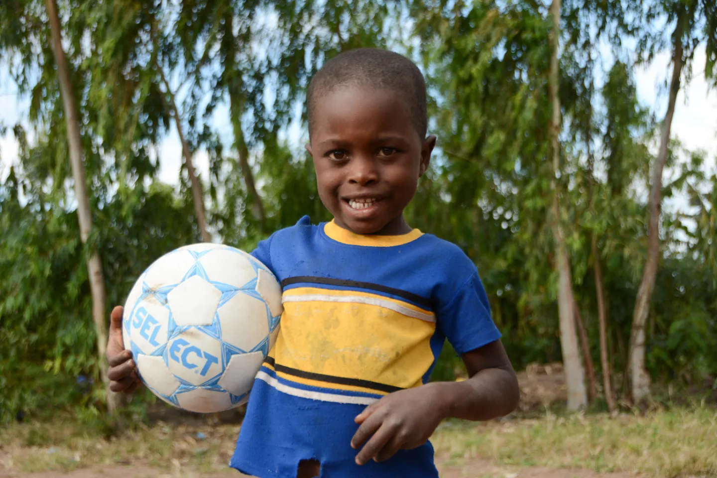 A little boy plays with a ball at Kubwera Kwa Yesu Children's Corner in Mulanje, Malawi.