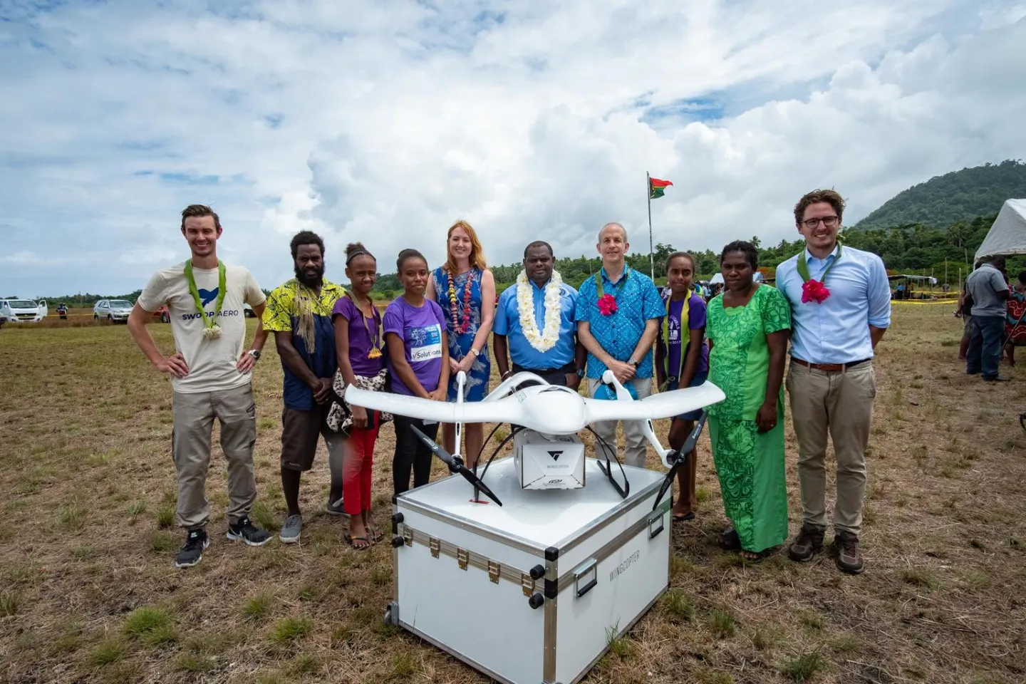 Susan Ryle Charg&eacute;e d&rsquo;Affaires, Australian High Commission in Vanuatu with Sheldon Yett UNICEF Pacific Representative, and Hon. Jack Norris Kalmet Minister of Health Vanuatu with representatives of the drone contractors, nurses Dominc Bule and Roslinda Takrawan and children of SMART sistas at the launch of the Vanuatu Drone trails for Vaccine delivery, Efate Island, Vanuatu. 