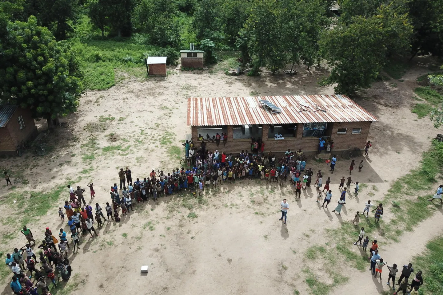 After the mapping mission, UNICEF&rsquo;s drone coordinator Tautvydas Juskauskas takes off the drone for the last time to make a drone selfie with the community members.