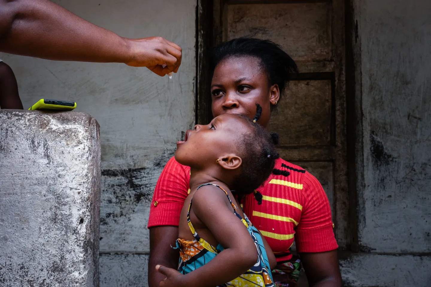 A child receives the oral polio vaccine in Bomi County, Liberia. 