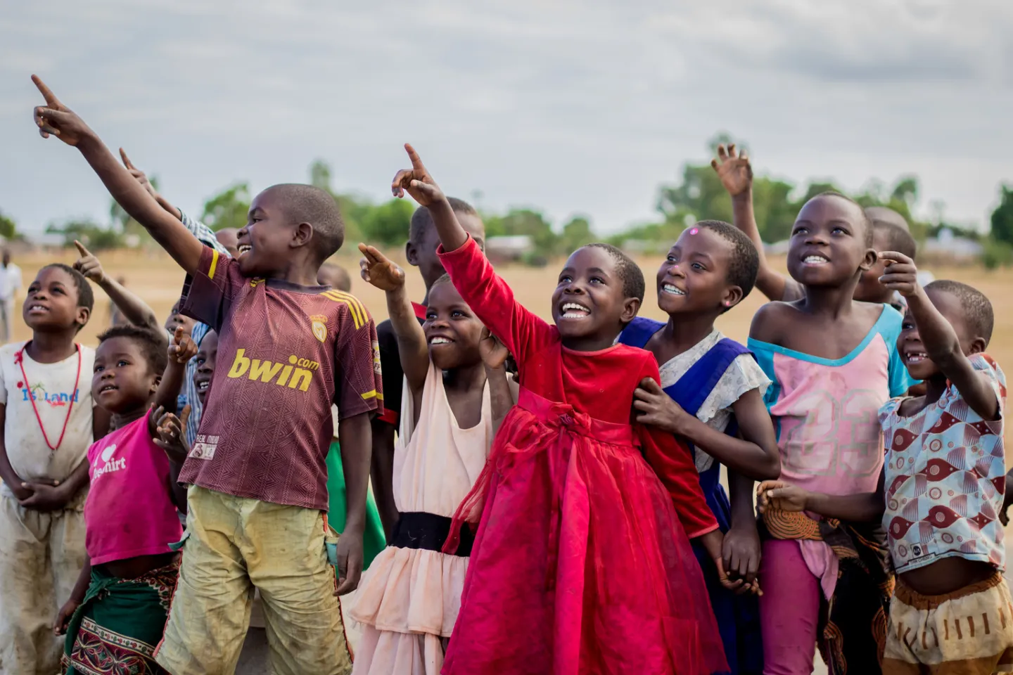 Children look on excited at the testing of unmanned aerial vehicle (UAVs) or drones