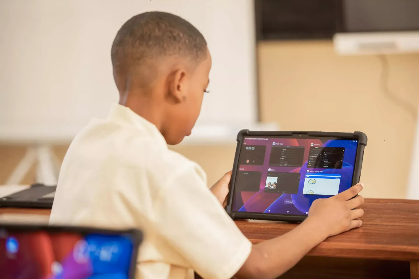 child looking at an ipad