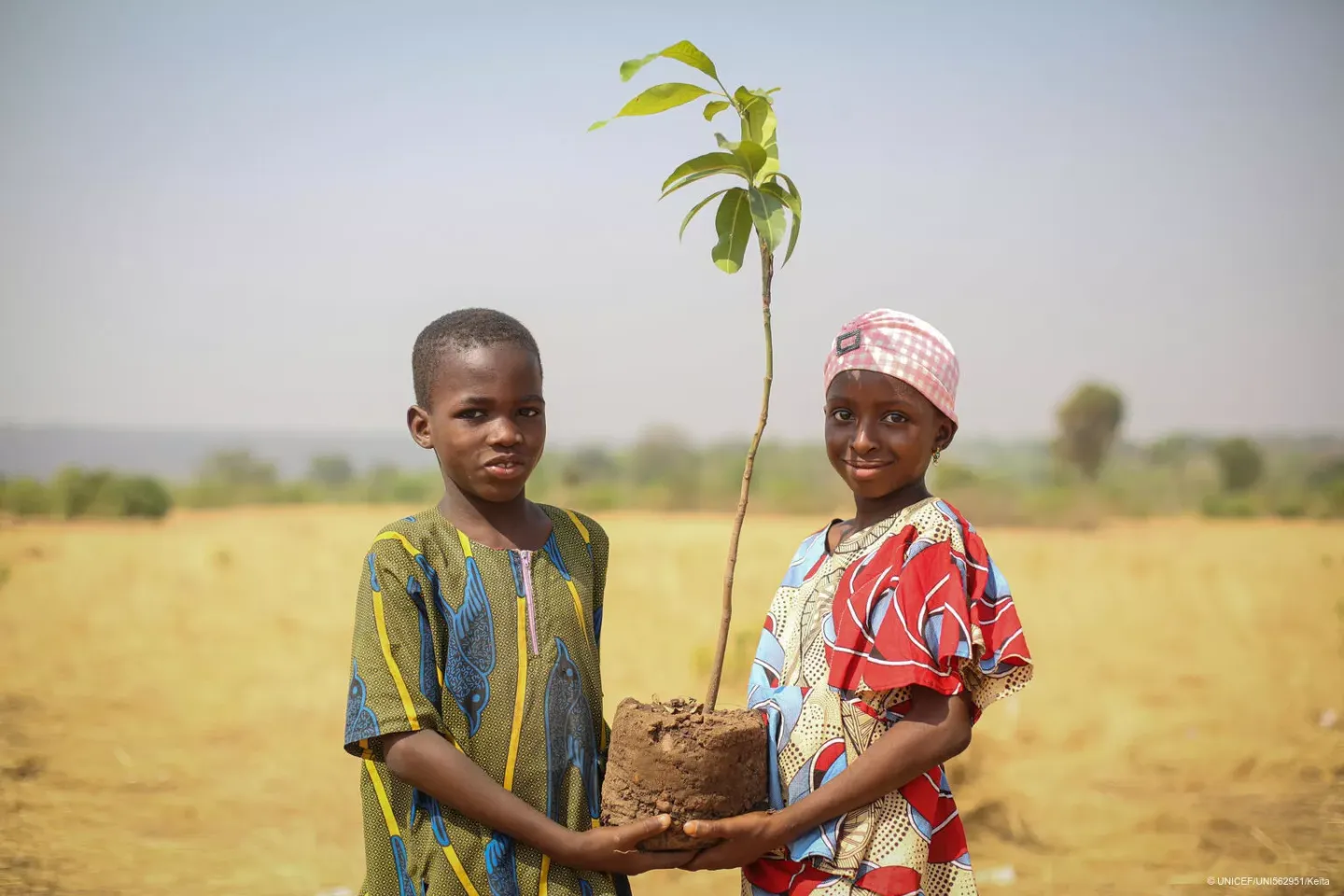 Children plant trees as part of World Earth Day