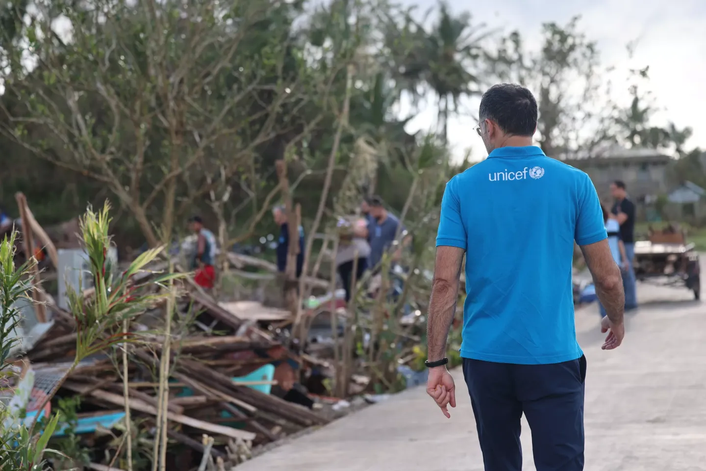UNICEF Staff walks through natural disaster