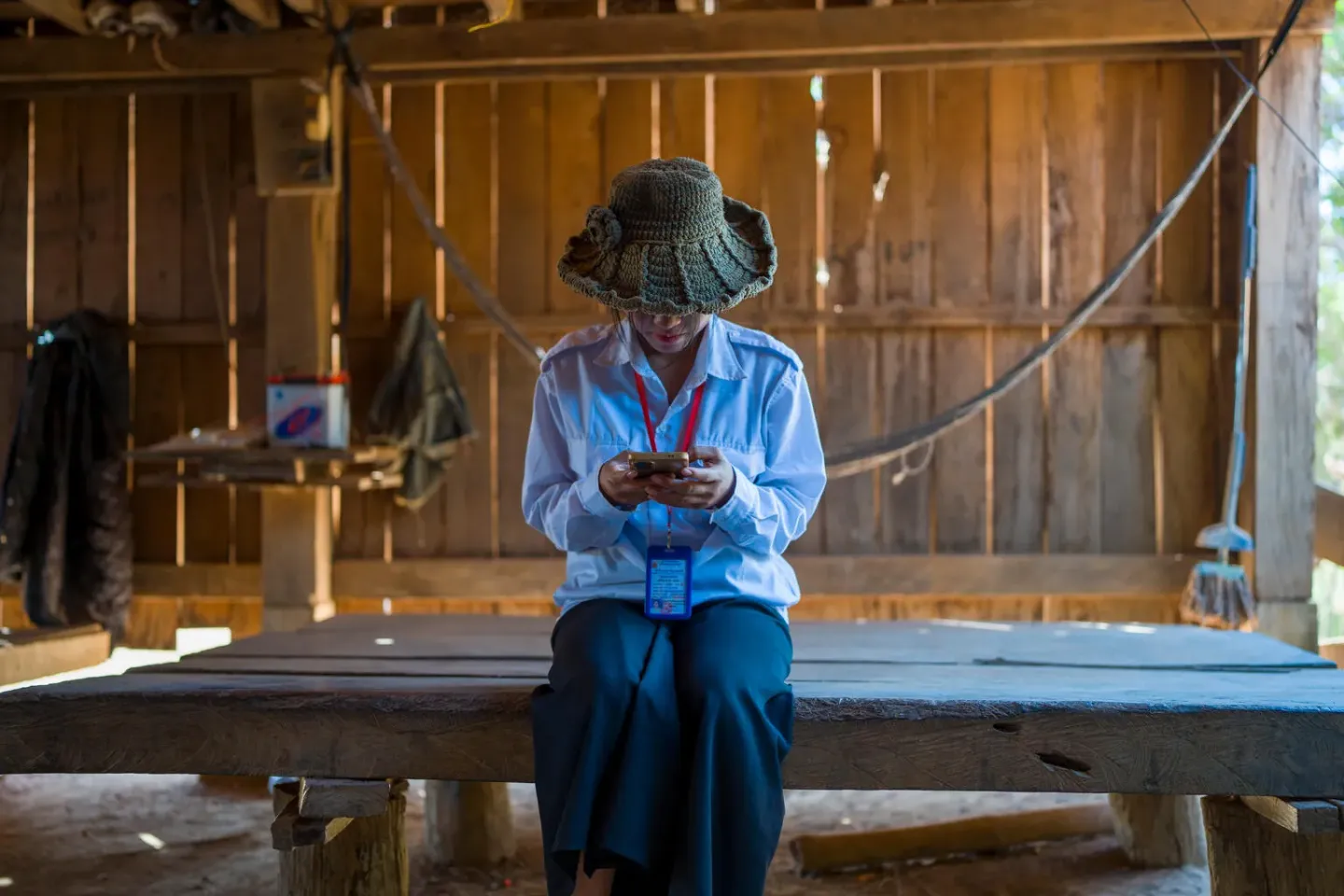 Cambodian girl looking at her phone. 