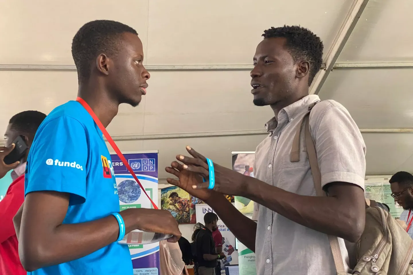 two young people in uganda speaking