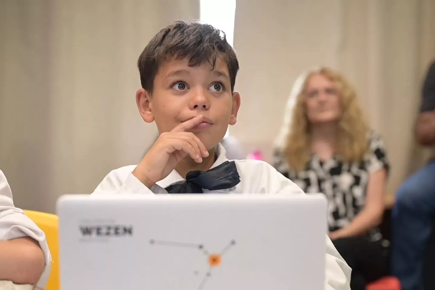 child looking at computer