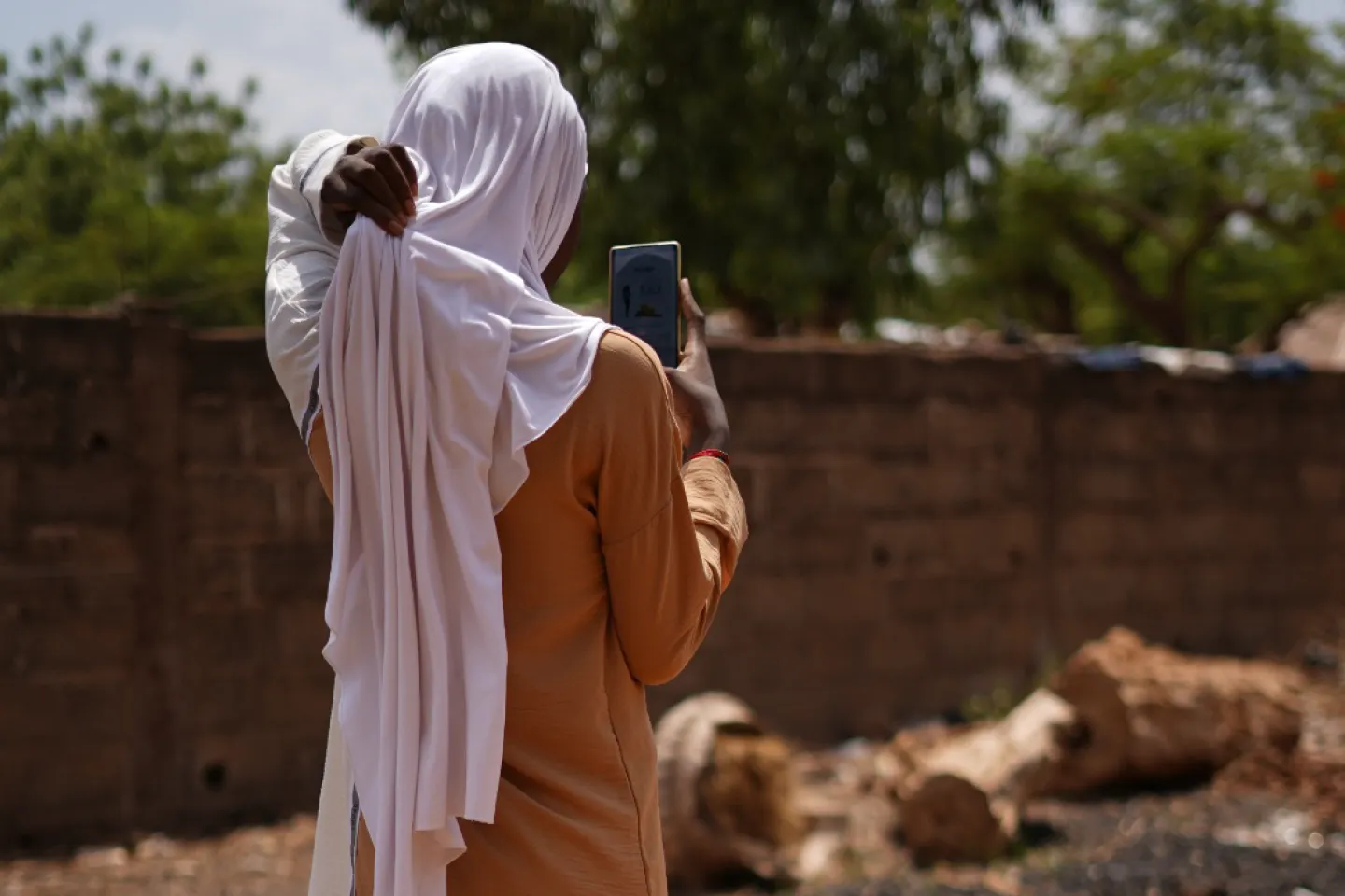 girl taking a photo of the environment