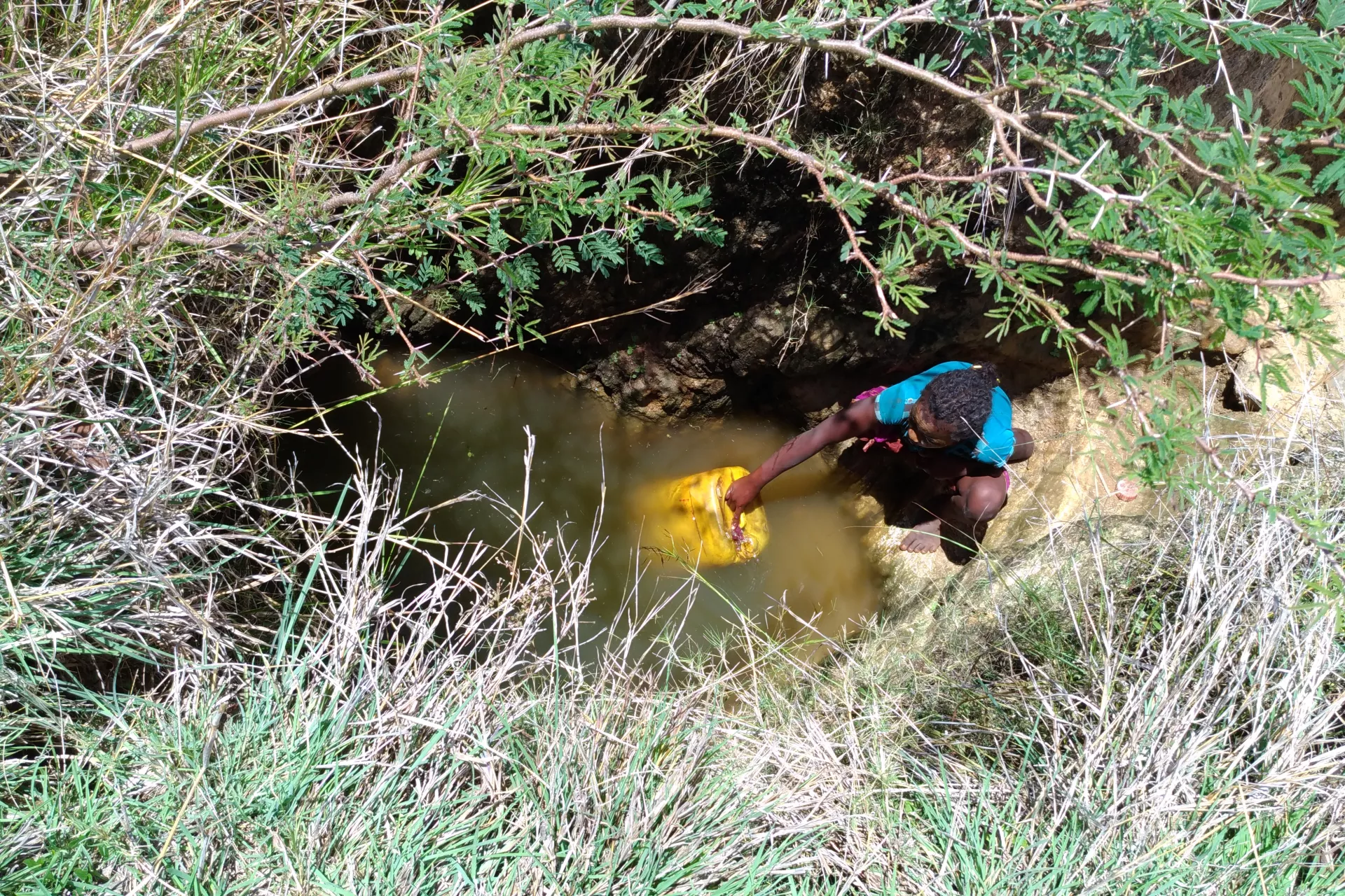 Girl fetching unsafe water