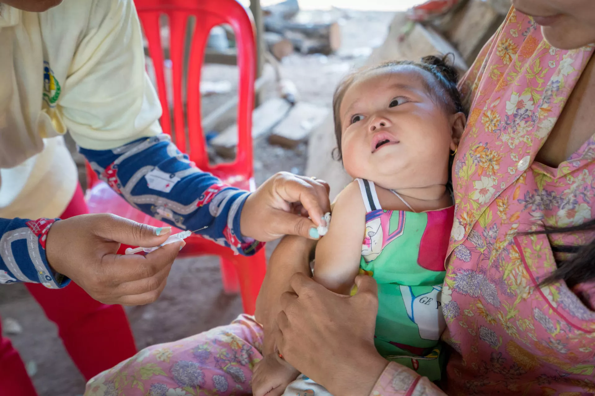 Thea Sreyvi receiving vaccines from Sambo health Centre&rsquo;s staff.