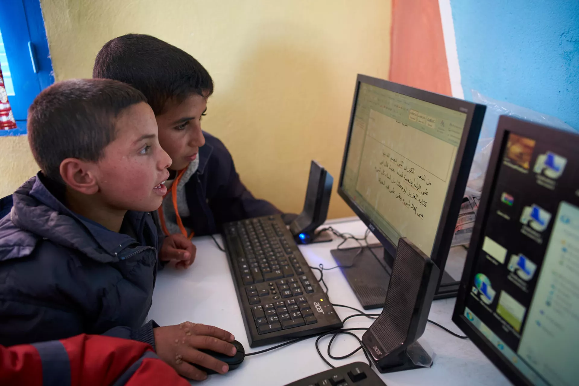 Children use computer in a library at Boufaroua Primary School on the outskirts of Sbeitla in Tunisia.