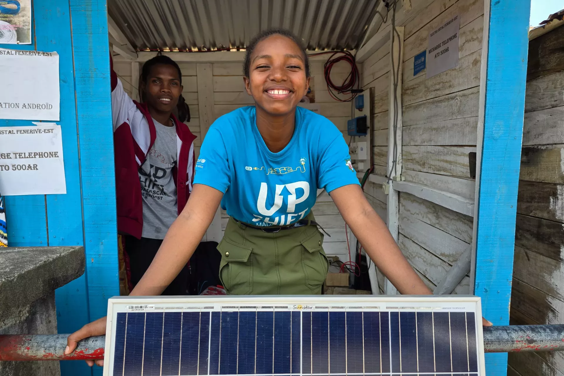 young girl fixing solar panels