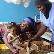 Caregiver and child in health facility