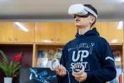 Vitalii, an 18-year-old college student and Upgrade team member from Ternopil in VR glasses.